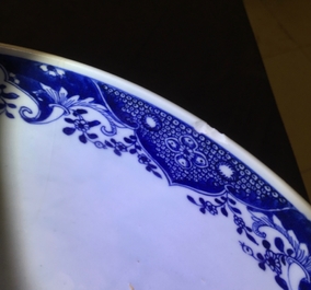 A large Chinese blue and white bowl with birds among blossoming flowers, Qianlong