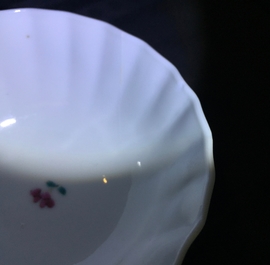 A pair of Chinese famille rose cups and saucers with peacocks, Qianlong