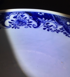 A large Chinese blue and white bowl with birds among blossoming flowers, Qianlong