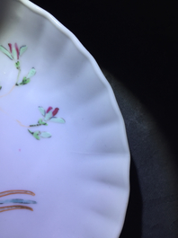 A pair of Chinese famille rose cups and saucers with peacocks, Qianlong