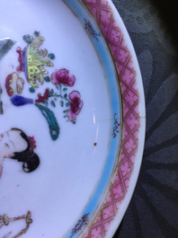 A Chinese famille rose cup and saucer with a lady and a boy, Yongzheng