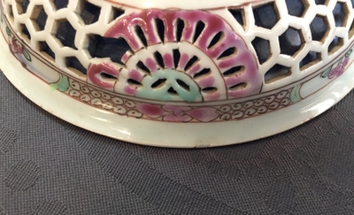 A Chinese double-walled famille rose cup and saucer, Yongzheng/Qianlong