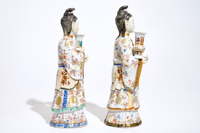 Two large Chinese famille rose candle holders modelled as court ladies, Qianlong