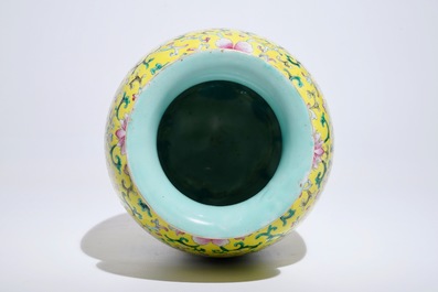 A Chinese yellow-ground famille rose vase, Qianlong mark, 19/20th C.
