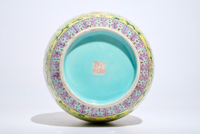 A Chinese yellow-ground famille rose vase, Qianlong mark, 19/20th C.
