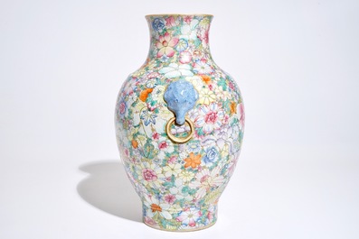 A Chinese famille rose millefleurs hu vase, Qianlong mark, 19/20th C.