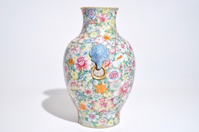 A Chinese famille rose millefleurs hu vase, Qianlong mark, 19/20th C.