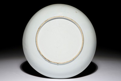 A Chinese famille rose ruby-ground plate, Yongzheng
