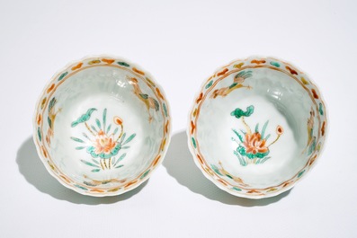 A pair of Chinese famille verte cups and saucers, Kangxi
