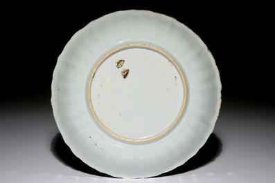 A Chinese Imari style plate with ladies in a garden, Kangxi