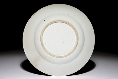 A Chinese famille verte "South Sea Bubble" plate with a Commedia Dell'Arte figure, Kangxi