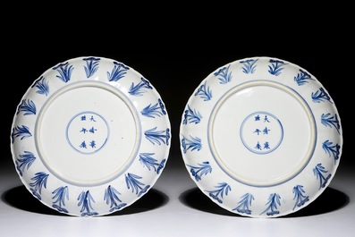 A pair of Chinese blue and white plates with fine landscapes, Kangxi