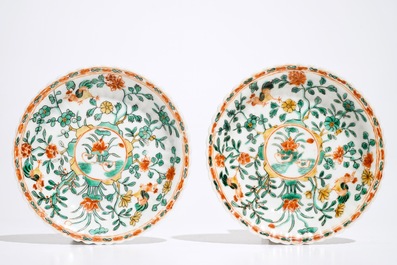 A pair of Chinese famille verte cups and saucers, Kangxi