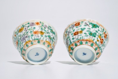 A pair of Chinese famille verte cups and saucers, Kangxi