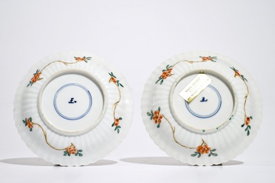 A pair of Chinese famille verte cups and saucers, Kangxi