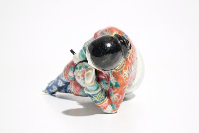 A Chinese famille rose model of a lady on a garden seat, 19th C.