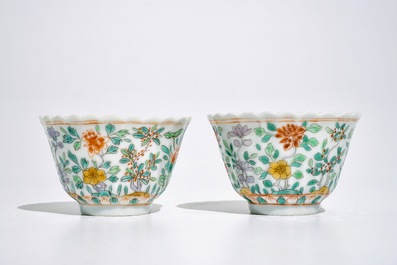 A pair of Chinese famille verte cups and saucers, Kangxi