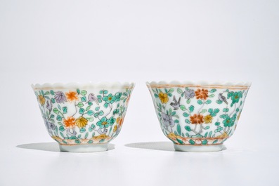 A pair of Chinese famille verte cups and saucers, Kangxi