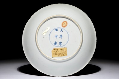 A Chinese famille verte plate with a lady in the garden, Kangxi mark and period