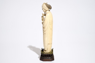 A Chinese ivory model of a lady on wooden base, 19th C.