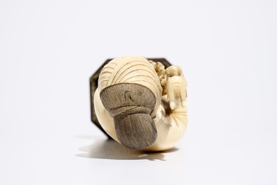 A Chinese ivory model of a lady on wooden base, 19th C.