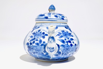 A Chinese blue and white teapot with figurative and floral panels, Kangxi