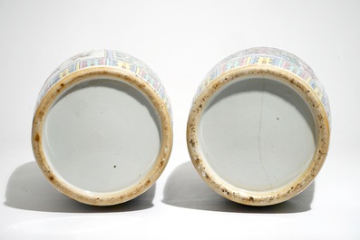 A pair of tall Chinese famille rose vases with court scenes, 19th C.