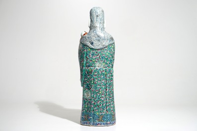 A tall Chinese famille rose figure of an immortal, 19th C.