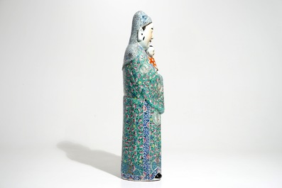 A tall Chinese famille rose figure of an immortal, 19th C.