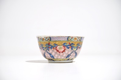 A Chinese famille rose cup and saucer with a cat, Yongzheng