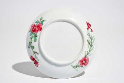 A Chinese famille rose cup and saucer with an insect on sanduo fruit, Yongzheng