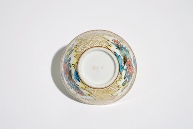 A Chinese famille rose cup and saucer with an insect on sanduo fruit, Yongzheng