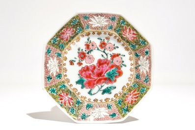 A Chinese famille rose cup and saucer with floral design, Yongzheng/Qianlong