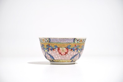 A Chinese famille rose cup and saucer with a cat, Yongzheng