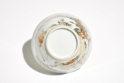 Une tasse et soucoupe en porcelaine de Chine &agrave; d&eacute;cor d'un paysage, Yongzheng