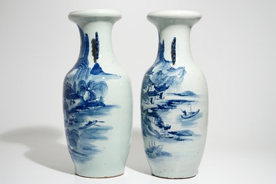Two tall Chinese blue and white landscape vases, 19/20th C.