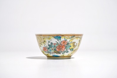 A Chinese famille rose cup and saucer with an insect on sanduo fruit, Yongzheng