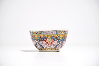 A Chinese famille rose cup and saucer with a cat, Yongzheng