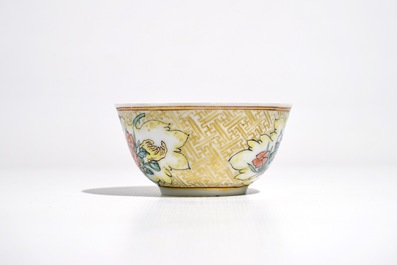 A Chinese famille rose cup and saucer with an insect on sanduo fruit, Yongzheng