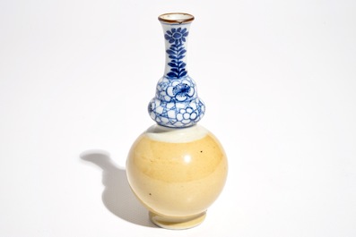 A Chinese blue and white and caf&eacute; au lait double gourd vase, Kangxi