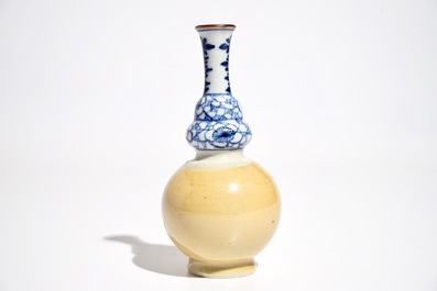 A Chinese blue and white and caf&eacute; au lait double gourd vase, Kangxi