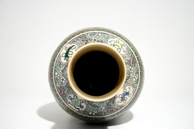 A Chinese verte enamel on biscuit vase with a fluvial landscape, Kangxi
