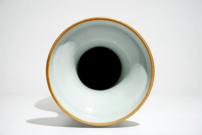 A tall Chinese famille rose vase with a fine circular design, 19th C.