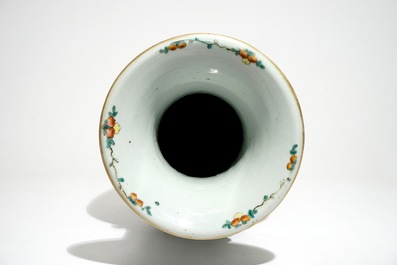 A tall Chinese famille rose vase with a court scene and peacocks, 19th C.