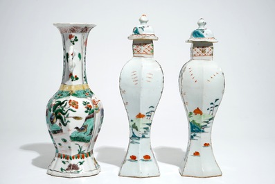 A Chinese famille verte vase with animals, Kangxi, with a pair of famille rose vases and covers, Qianlong