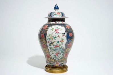 A Chinese bronze-mounted famille rose on blue-ground baluster vase and cover, Yongzheng