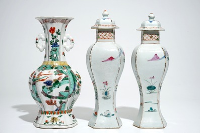 A Chinese famille verte vase with animals, Kangxi, with a pair of famille rose vases and covers, Qianlong