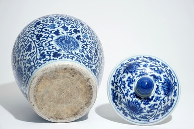 A tall Chinese blue and white baluster jar and cover with lotus scrolls, Kangxi