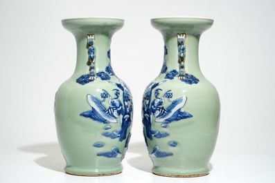 A pair of Chinese celadon-ground vases with blue and white figures, 19th C.