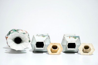 A Chinese famille verte vase with animals, Kangxi, with a pair of famille rose vases and covers, Qianlong